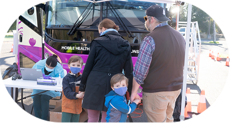 bus-exterior-patients-signing-in-crop